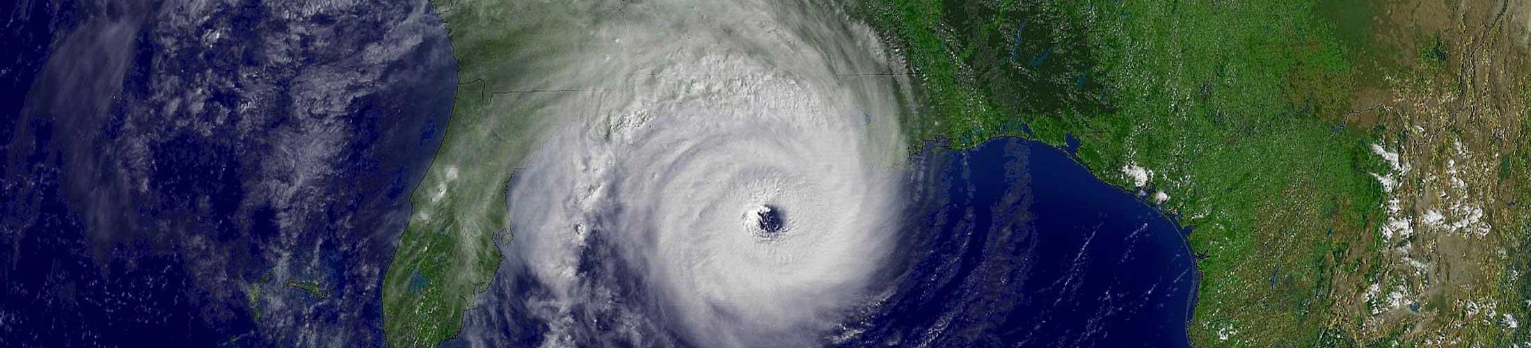 Image of hurricane over land and water.